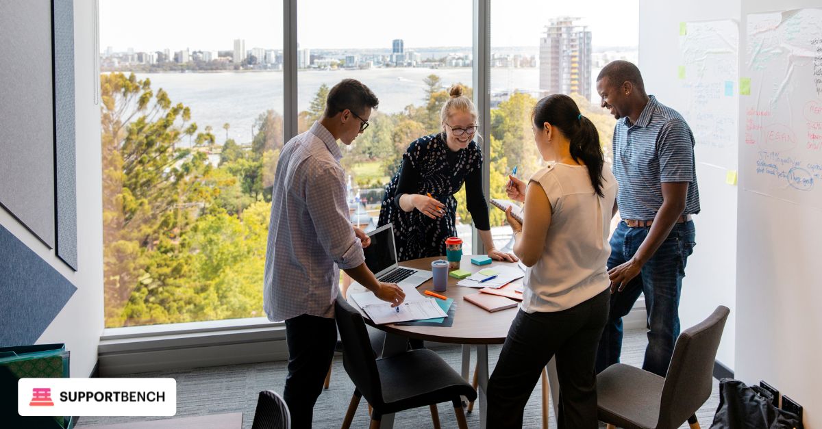 A group of professionals in an office engaged in discussion about company culture and its impact on customer service