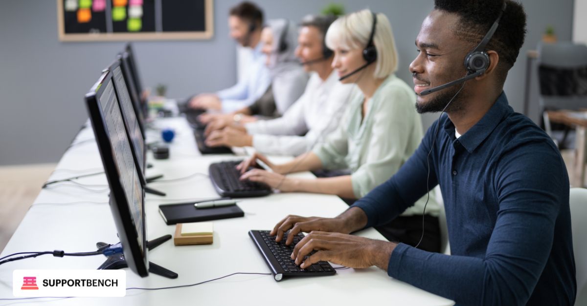 A woman with a headset sits at a desk, focused on her laptop, enhancing customer support efficiency.