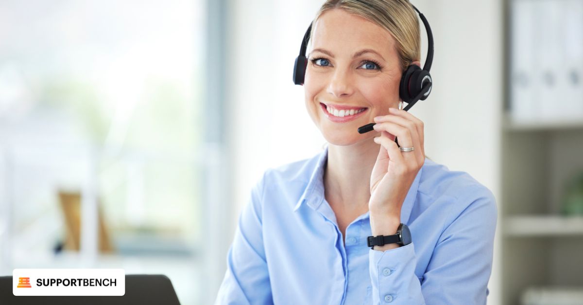 A woman in a call center wearing headphones, focused on managing support tickets and ticket escalation tasks