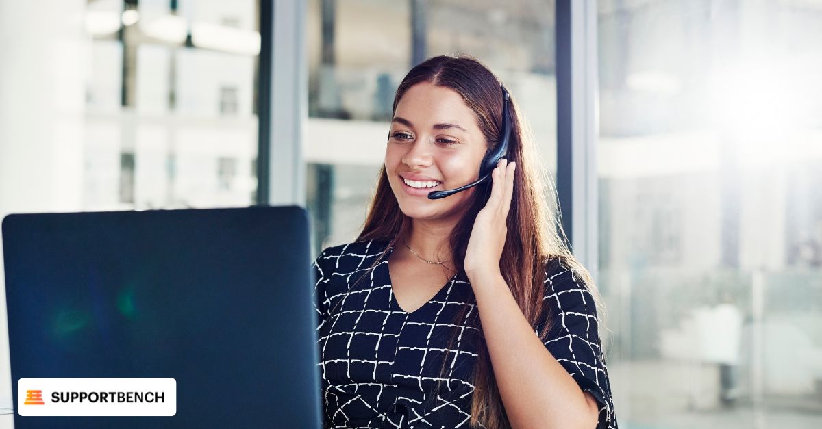 A woman with a headset in an office, focused on improving customer journey and retention strategies for better satisfaction