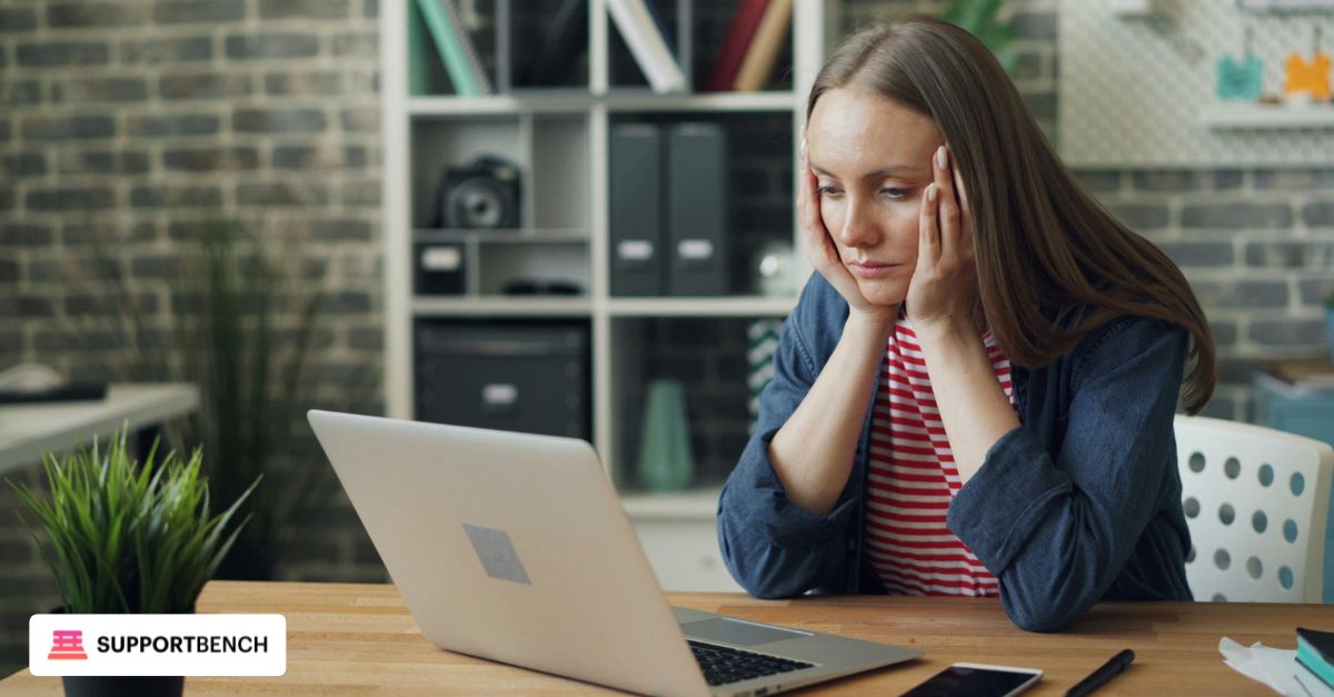 An overwhelmed HR professional looking at a cluttered inbox while trying to handle multiple requests