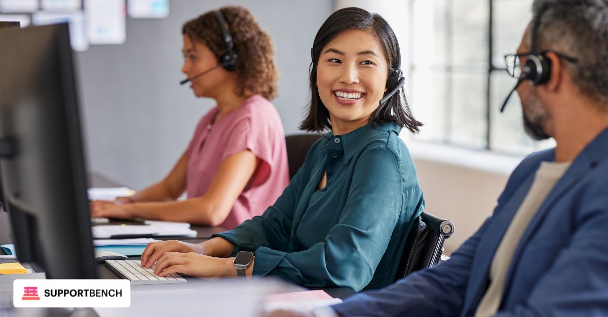 A team of IT support agents working collaboratively in a helpdesk environment