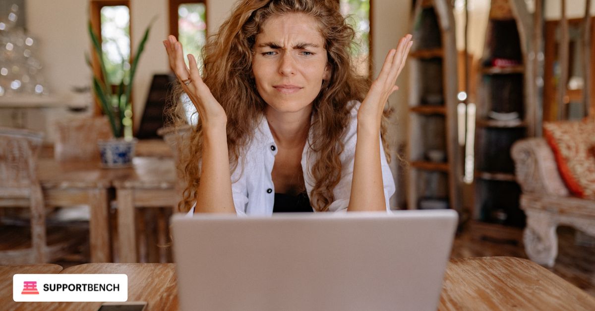 A frustrated MSP technician facing a screen with overwhelming support tickets, highlighting inefficiencies in using a general helpdesk as operations scale.