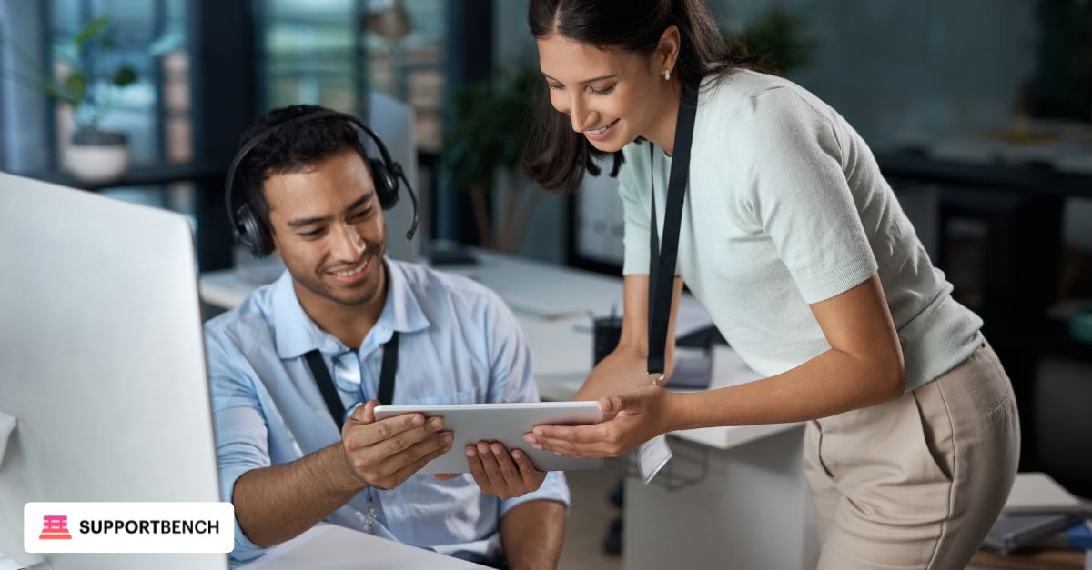 Two technical support agents juggling multiple monitors